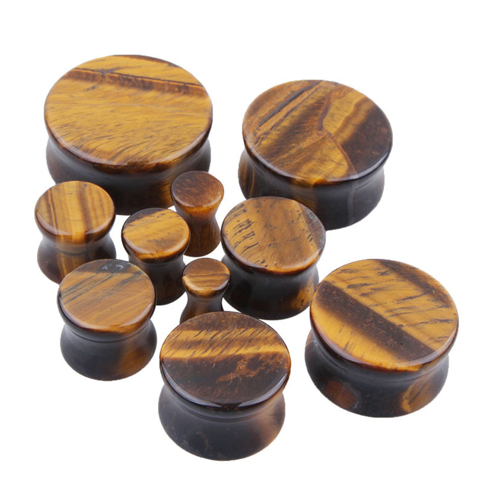 Collection of Yellow Tigerite Stone Ear Plugs in various sizes for body jewelry lovers. Perfect for rock style outfits.