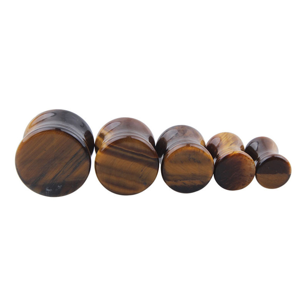 Yellow Tigerite stone ear plugs in various sizes, perfect for body jewelry enthusiasts and rock style lovers.