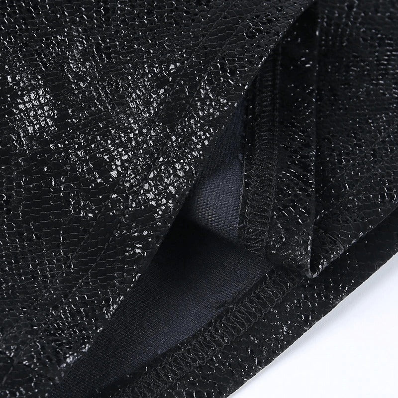 Close-up of black textured fabric showcasing the stylish sheen, perfect for a punk-inspired mini skirt.