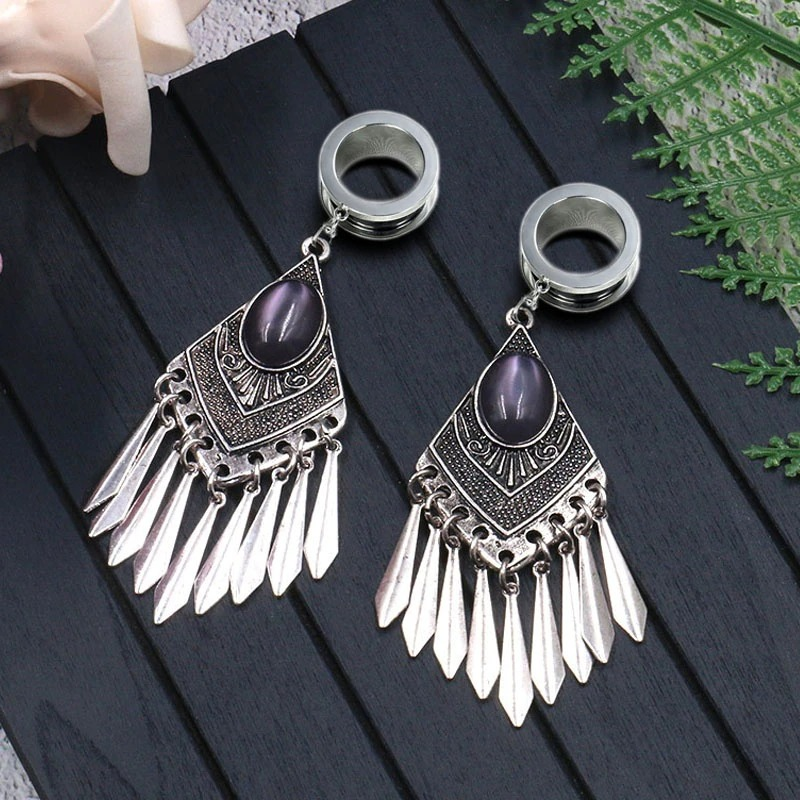 Elegant women's gothic stainless steel earrings with purple stones and decorative fringe design.