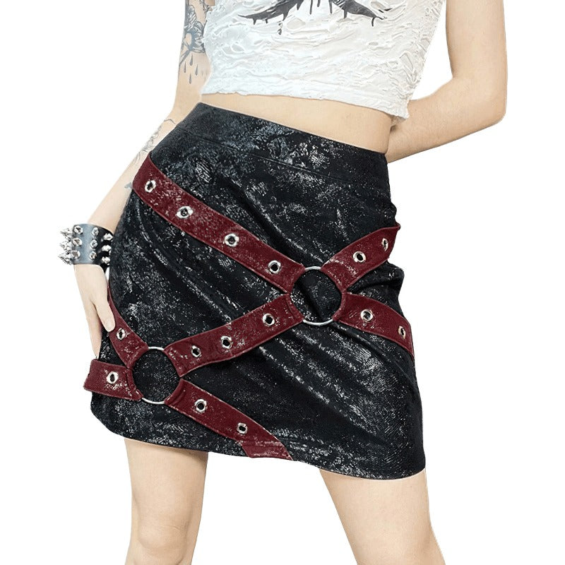 Women's high-waisted mini skirt with rivet straps and rings in punk style, perfect for gothic outfits.