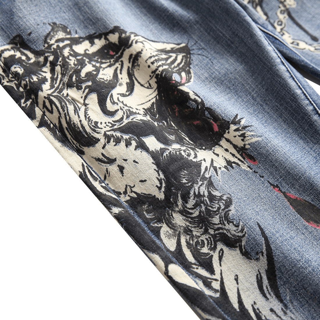 Close-up of 3D printed punk denim pants featuring a stylish graphic design on a blue denim background.
