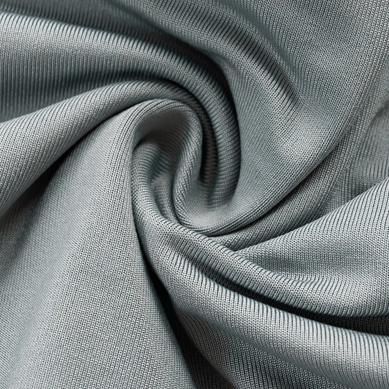 Close-up of soft green fabric showcasing texture for women's cut out long sleeve crop top.