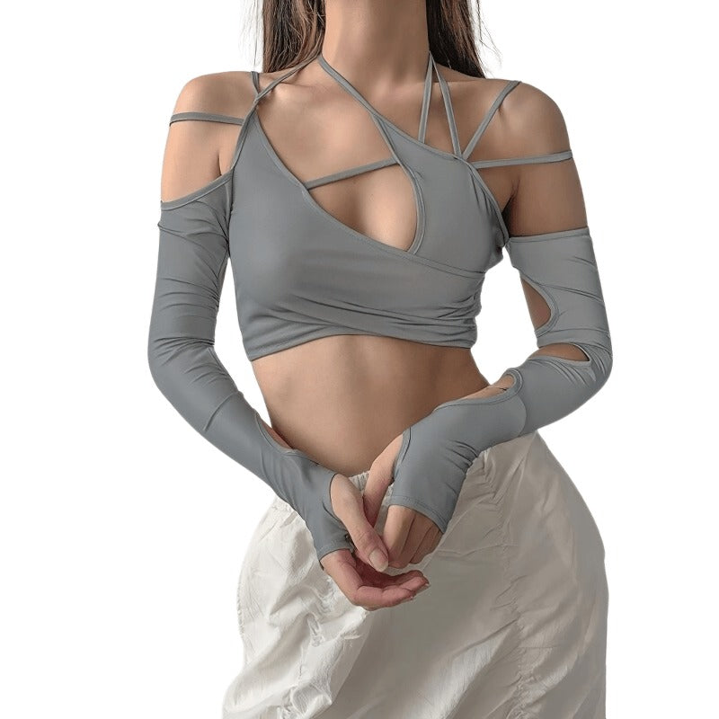 Stylish women's cut out long sleeve crop top in grey, featuring asymmetrical design and trendy cutouts.