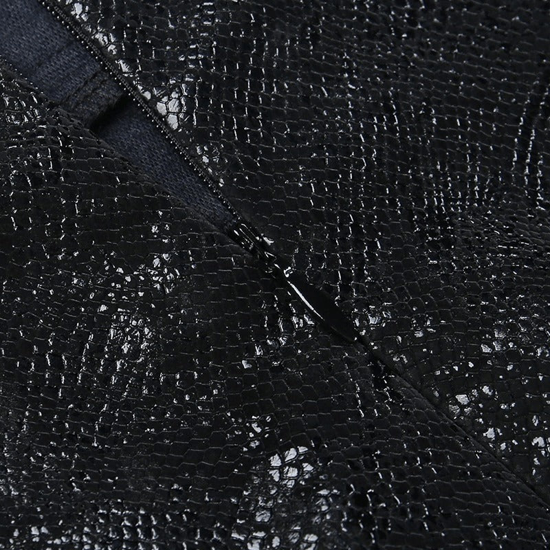 Close-up of textured black fabric with zipper detail, perfect for a high-waisted mini skirt.