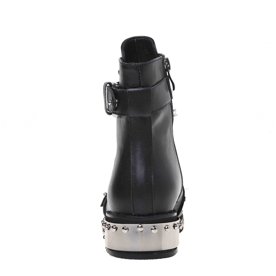Back view of women's genuine leather punk rock ankle boots with rivets and a stylish silver flat heel.