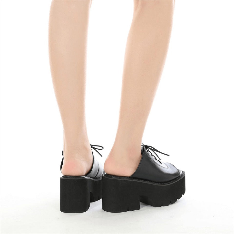 Black leather open-toe mules sandals with platform heels, showcasing a chic gothic style for women.