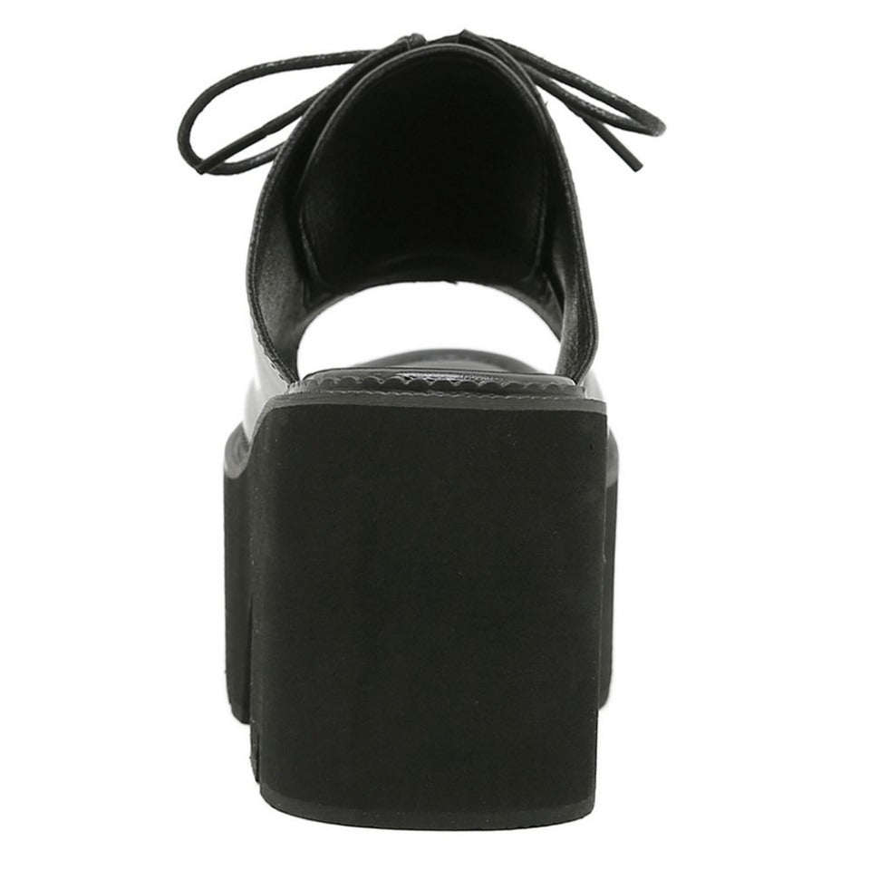 Back view of stylish black PU leather open toe mules sandals with platform heels, perfect for a gothic look.