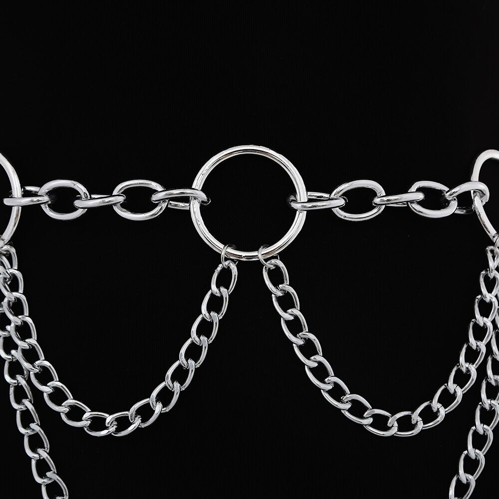 Close-up of a 90s-style metal chain belt with three rings and dangling chains, perfect for stylish layering.