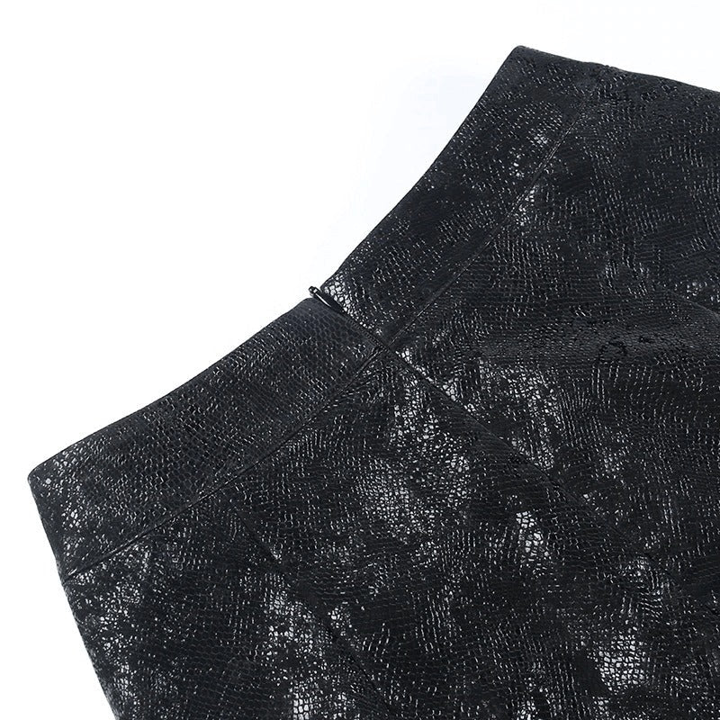 Close-up of women's high-waisted mini skirt showcasing its unique texture and modern design.