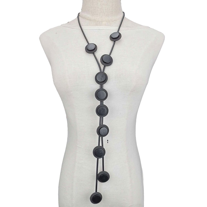 Ethnic long rubber pendant necklace for women, featuring a stylish gothic design and unique circular accents.