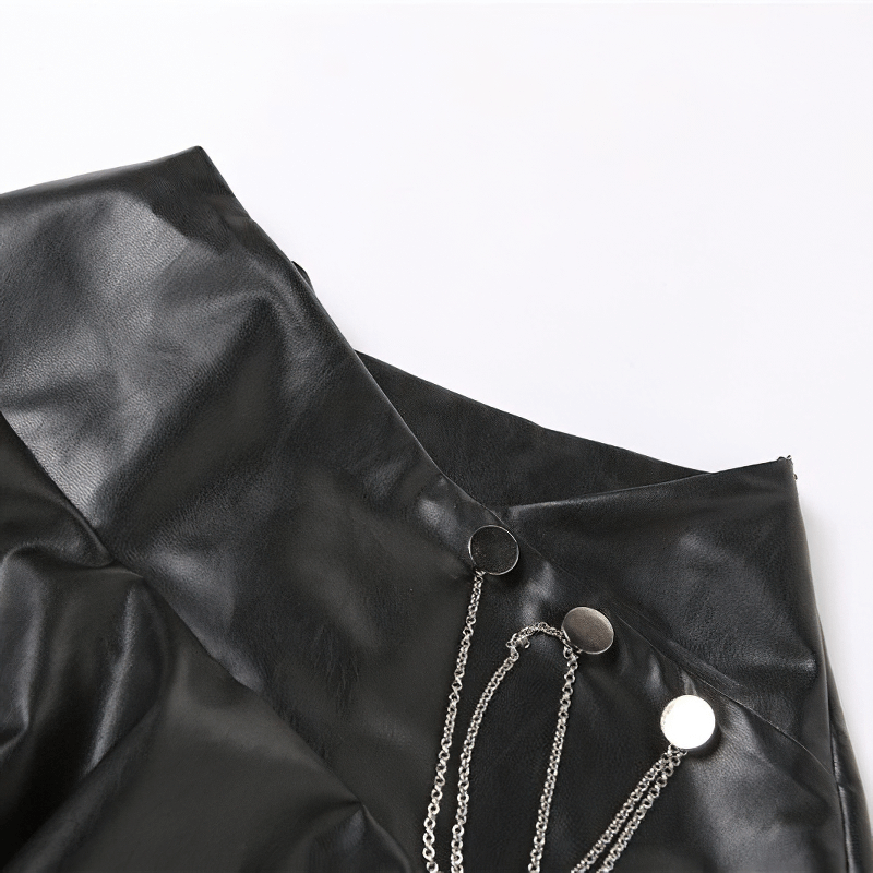 Close-up of A-line black faux leather mini skirt with metal chain leg garter, perfect for punk rock fashion.