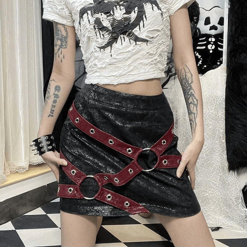 Stylish women's high-waisted mini skirt with rivet straps and rings, perfect for gothic punk outfits.
