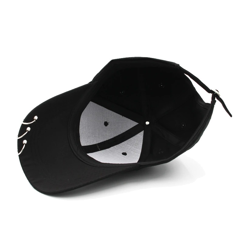 Inside view of a unisex adjustable black baseball cap with ring piercing, perfect for punk style fashion.