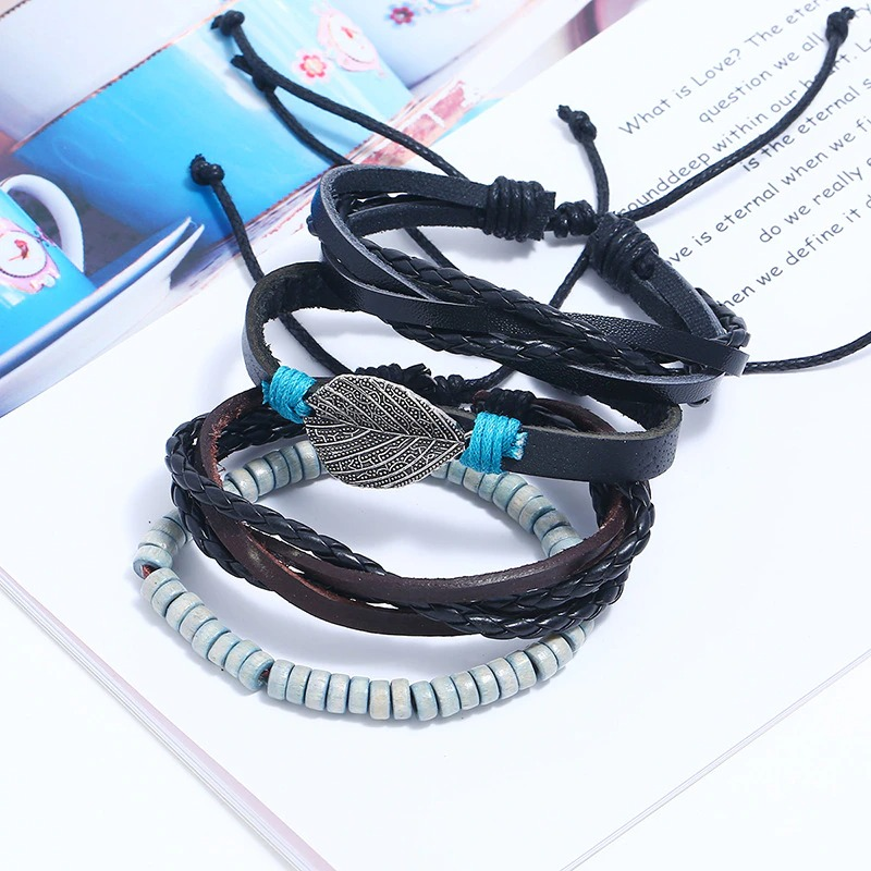 Adjustable leather bracelet set featuring multi-layered punk style with silver feather pendant, stylish for men and women.
