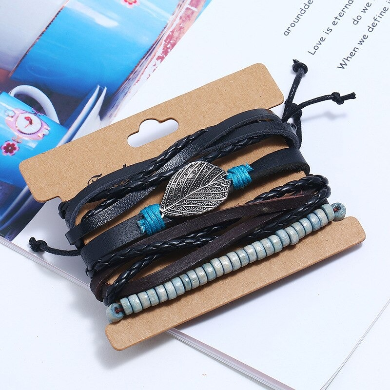 Adjustable multi-layered leather bracelet set with silver feather pendant, perfect for punk style outfits.