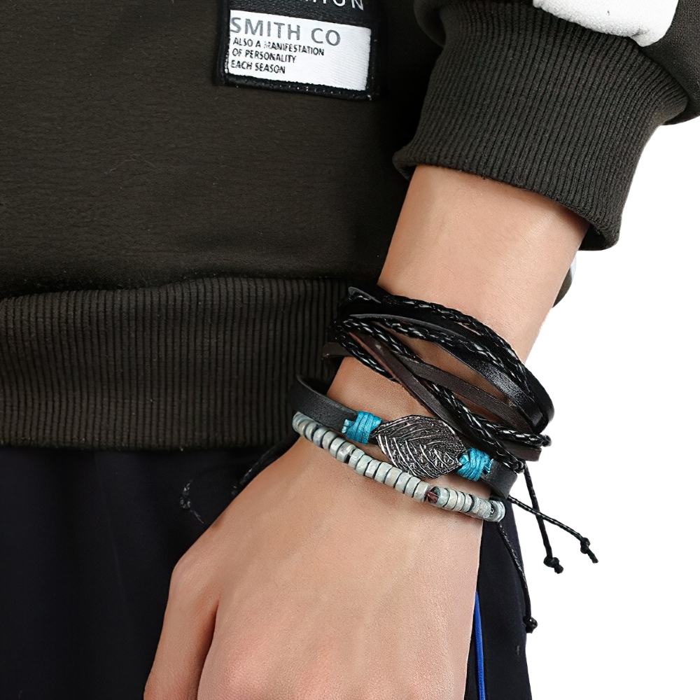 Stylish adjustable leather bracelet set for men and women with multi-layered design and silver feather pendant.