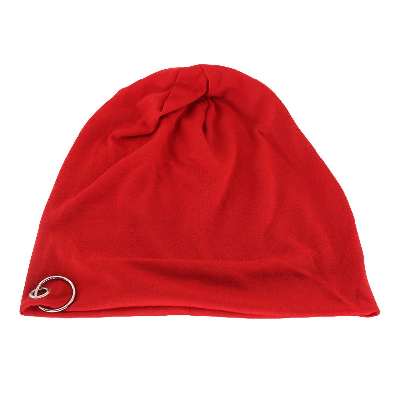 Red unisex beanie with metal ring, perfect for minimalistic autumn and winter fashion.