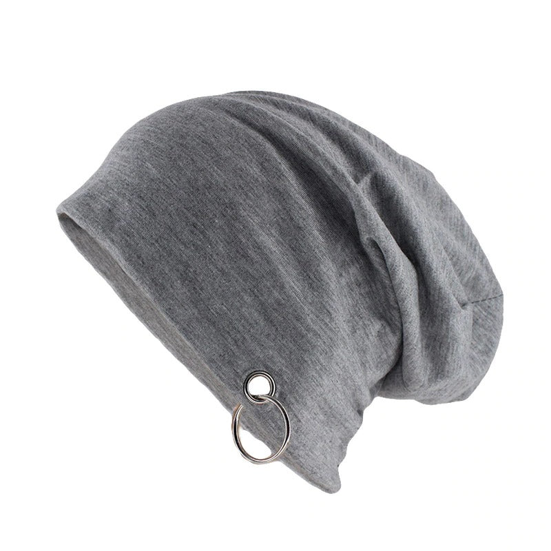 Stylish grey beanie with metal ring, perfect for minimalistic autumn and winter fashion.