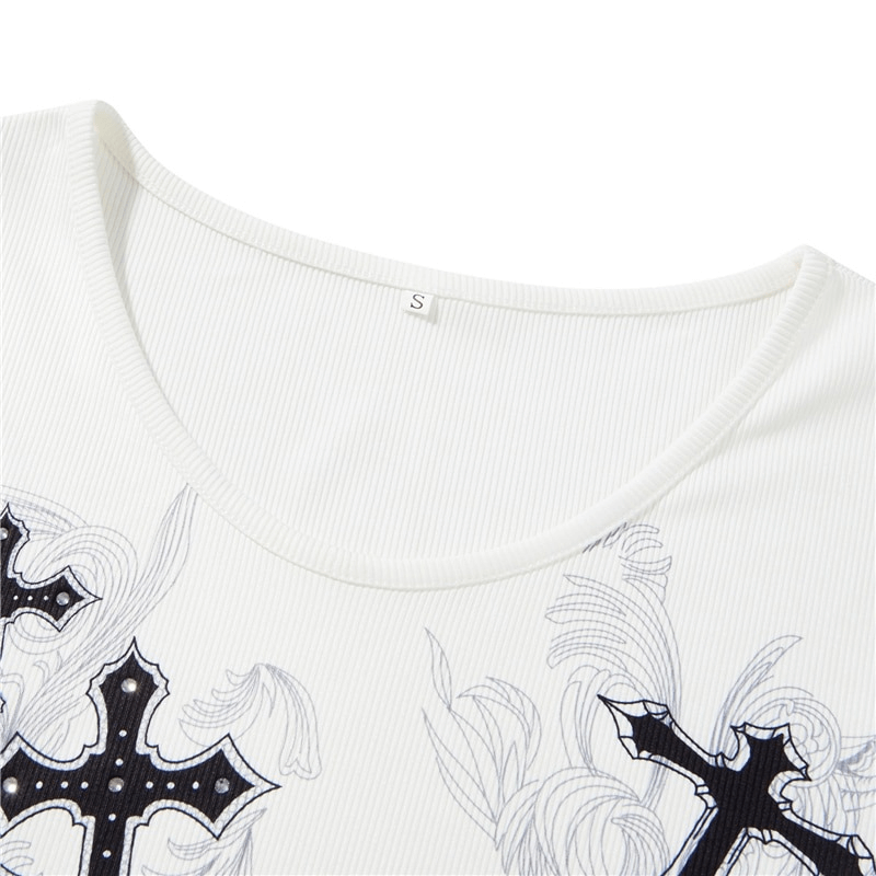 Close-up of a white women's top featuring cross wings print and ribbed texture, perfect for an aesthetic wardrobe.