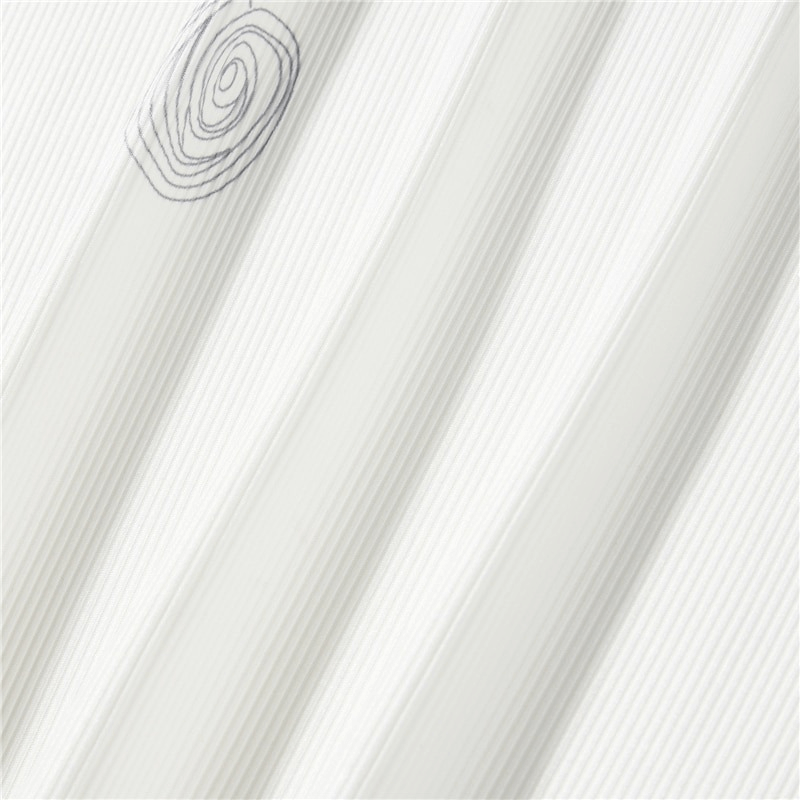 Close-up of textured white fabric featuring a stylish spiral design, perfect for aesthetic fashion tops.