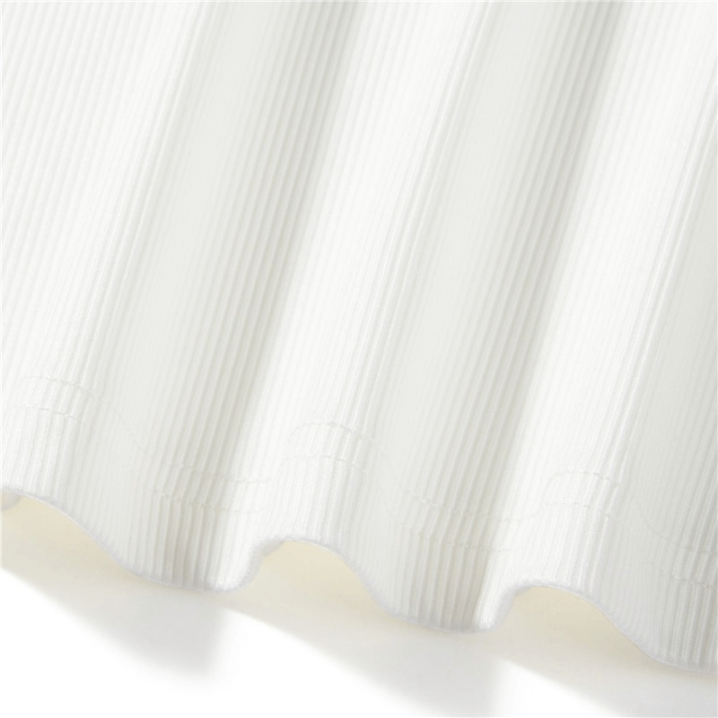 Close-up of white ribbed fabric, showcasing texture for an aesthetic long sleeve top.