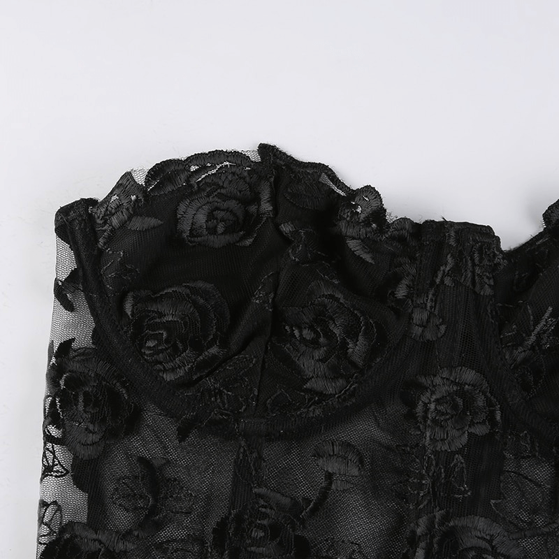 Elegant black floral lace crop top featuring transparent fabric, perfect for an aesthetic women's wardrobe.