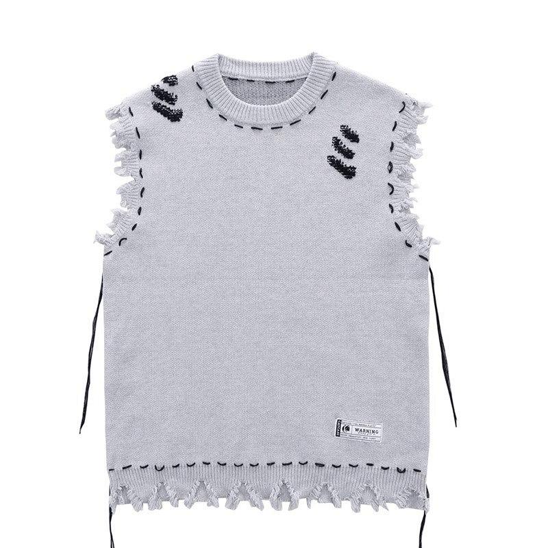 Vintage oversized sleeveless knitted vest with fringed edges and unique detailing for aesthetic wardrobe.