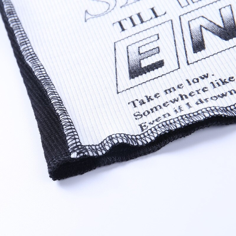Close-up of graphic print patchwork fabric featuring bold text, reflecting a punk style aesthetic for women.