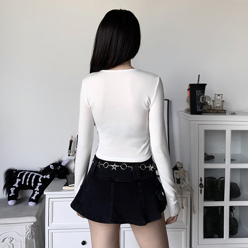 Aesthetic women's crop top styled with a black skirt, featuring a unique chain detail for a gothic look.
