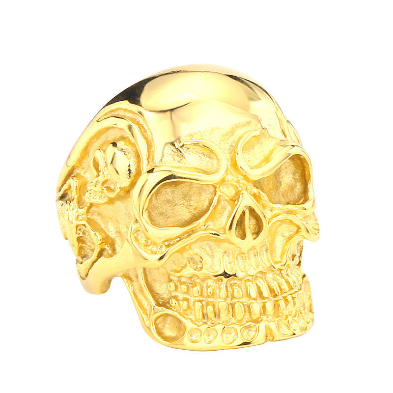Shiny gold big triple skull ring, showcasing rock style biker jewelry with intricate skull details.