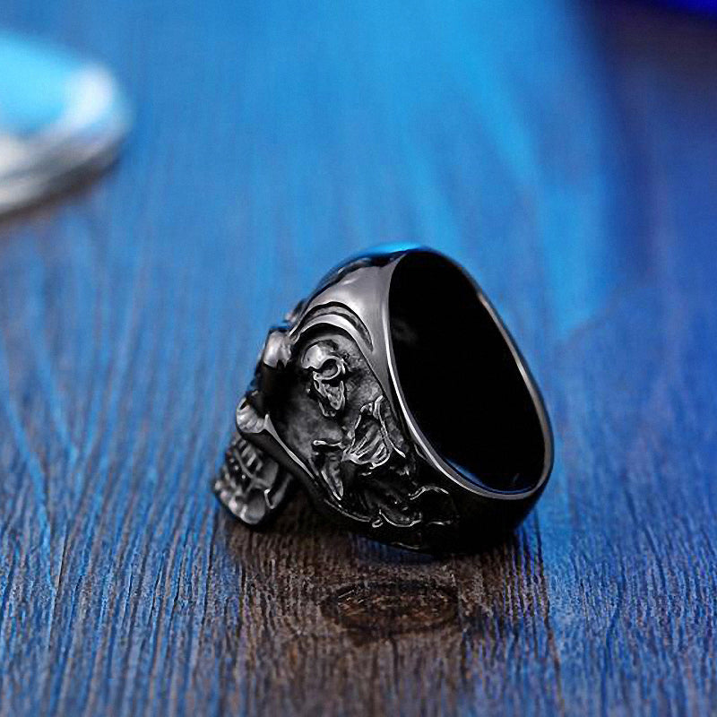 Big triple skull ring showcasing a detailed skull design, perfect for rock fashion and biker style enthusiasts.