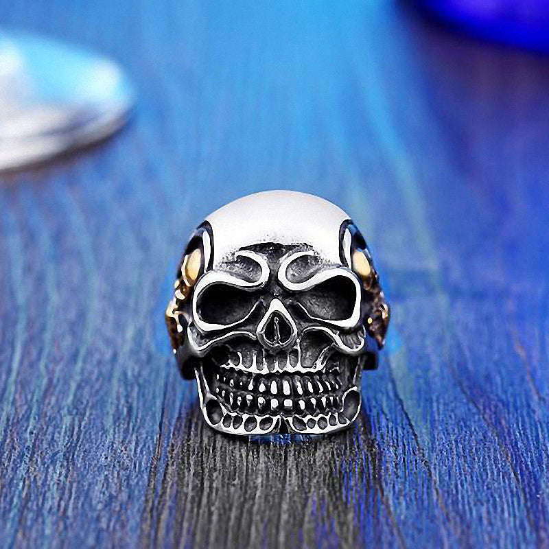 Big triple skull ring in stainless steel, perfect rock-style biker jewelry for bold fashion statements.