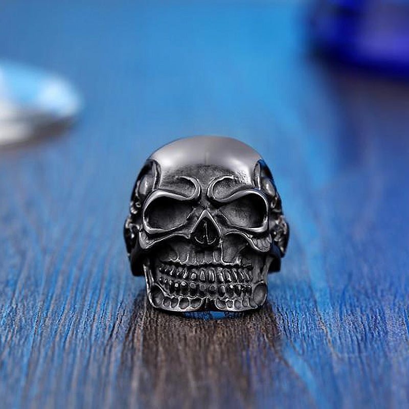 Big triple skull ring in stainless steel, perfect rocker accessory for a bold fashion statement.