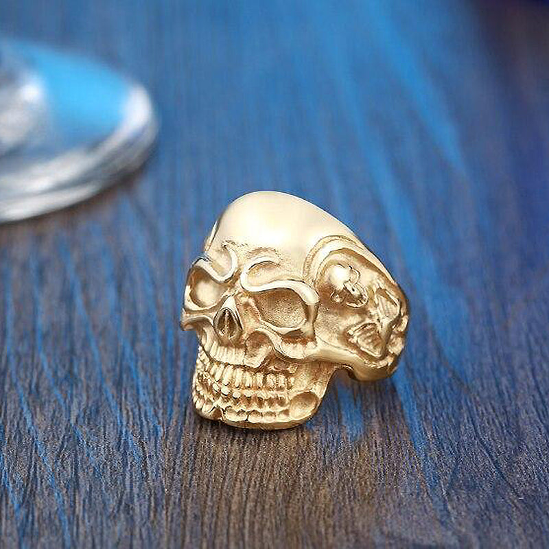 Big Triple Skull Ring in gold, rock style biker jewelry, perfect for making a statement at any party.