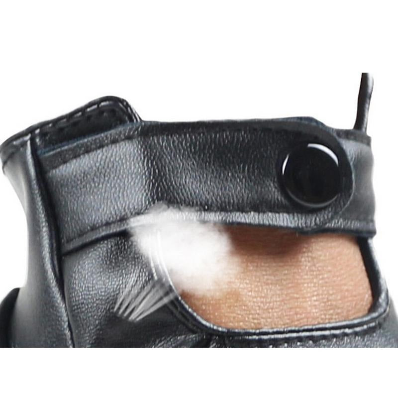 Close-up of black PU leather half-finger punk gloves showcasing comfortable button and breathable design.