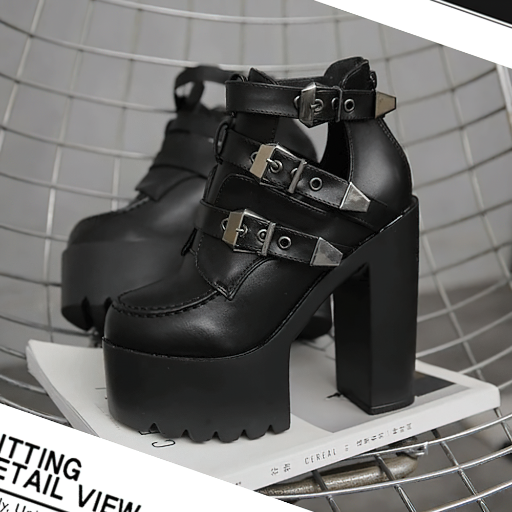 Stylish black leather platform boots with metal buckles and high square heel for alternative fashion.
