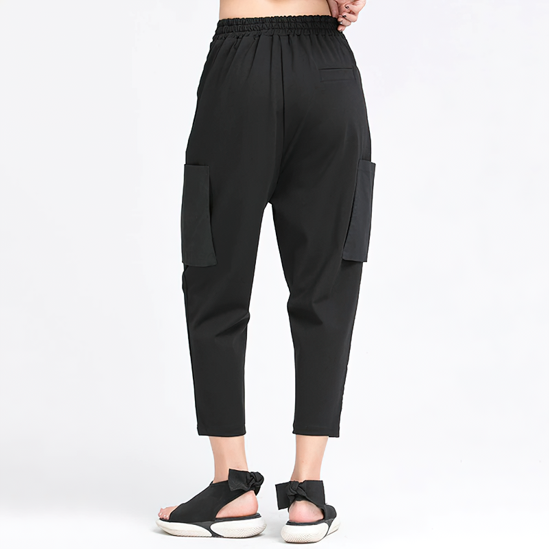 Back view of women's alternative style high elastic waist black trousers with pockets, perfect for casual outings.