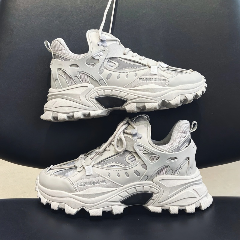 Stylish white alternative sneakers with high soles on a black chair, perfect for comfort and fashion-forward looks.