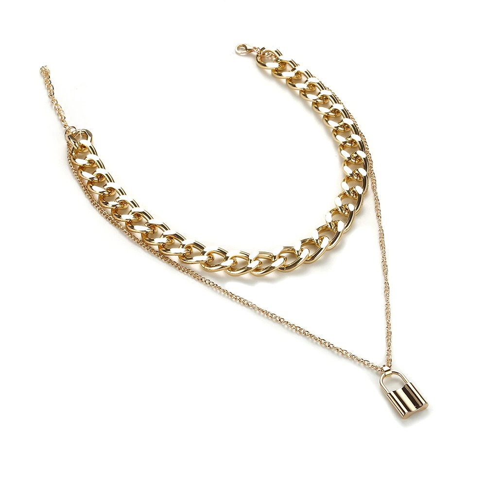Alternative style padlock pendant necklace with double gold chains, perfect for punk fashion enthusiasts.