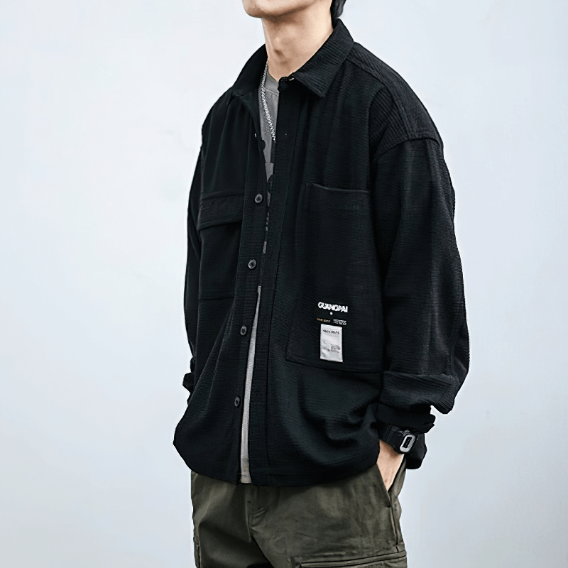 Men's loose waffle plaid shirt in black with pockets, showcasing alternative style fashion.