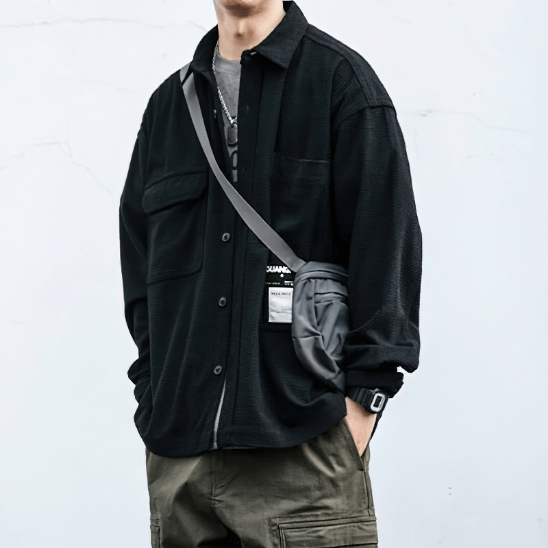 Men's loose black waffle plaid shirt with pockets, styled for alternative fashion, perfect for casual wear.