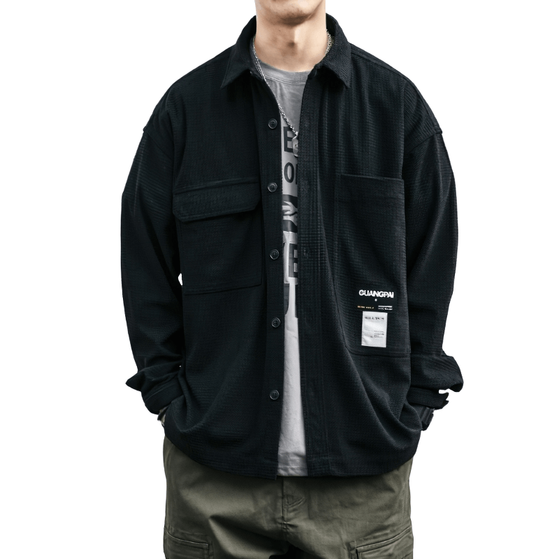 Loose men's waffle plaid shirt in black with pockets, perfect for an alternative style outfit.