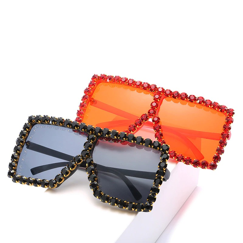 Trendy women's sunglasses with rhinestones in black and orange styles, perfect for an alternative vintage look.