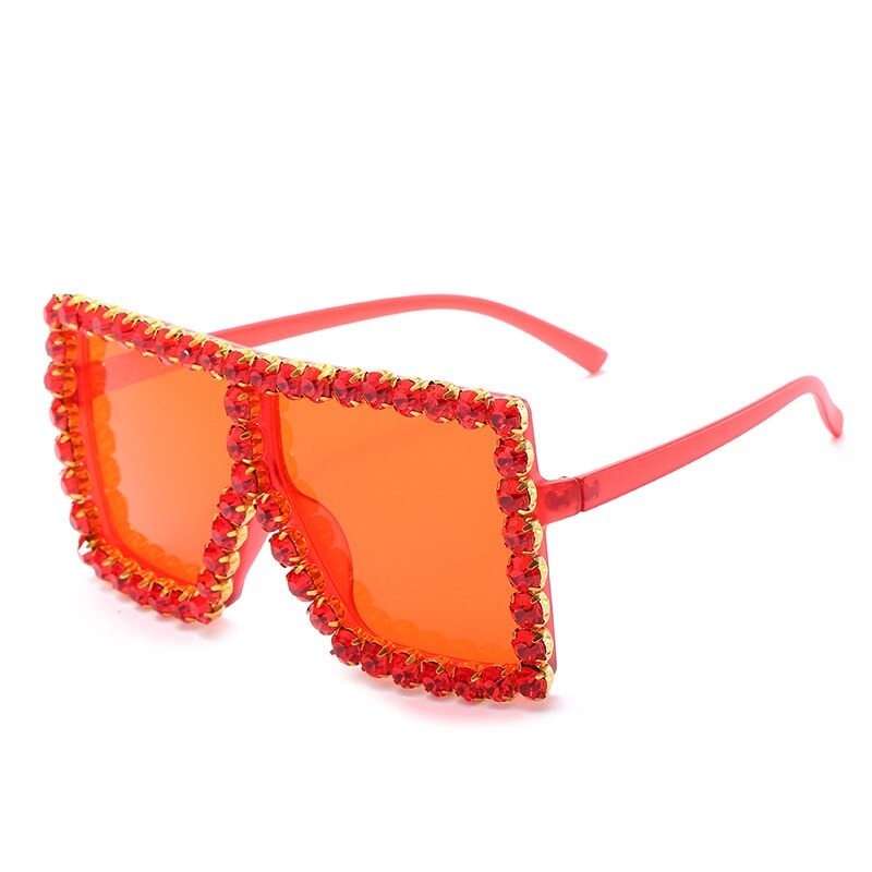 Alternative style women's sunglasses with red rhinestones and oversized frames for a trendy, bold look.