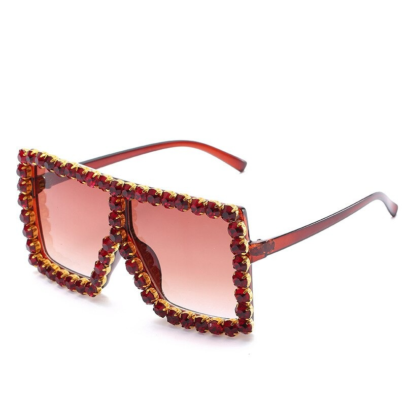 Trendy vintage women's sunglasses with rhinestones, stylish oversized frame in a bold red hue.