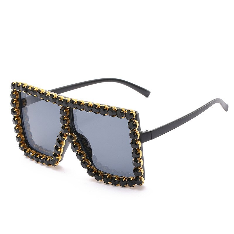 Trendy women's rhinestone sunglasses with a stylish square frame and gold accent, perfect for alternative fashion.
