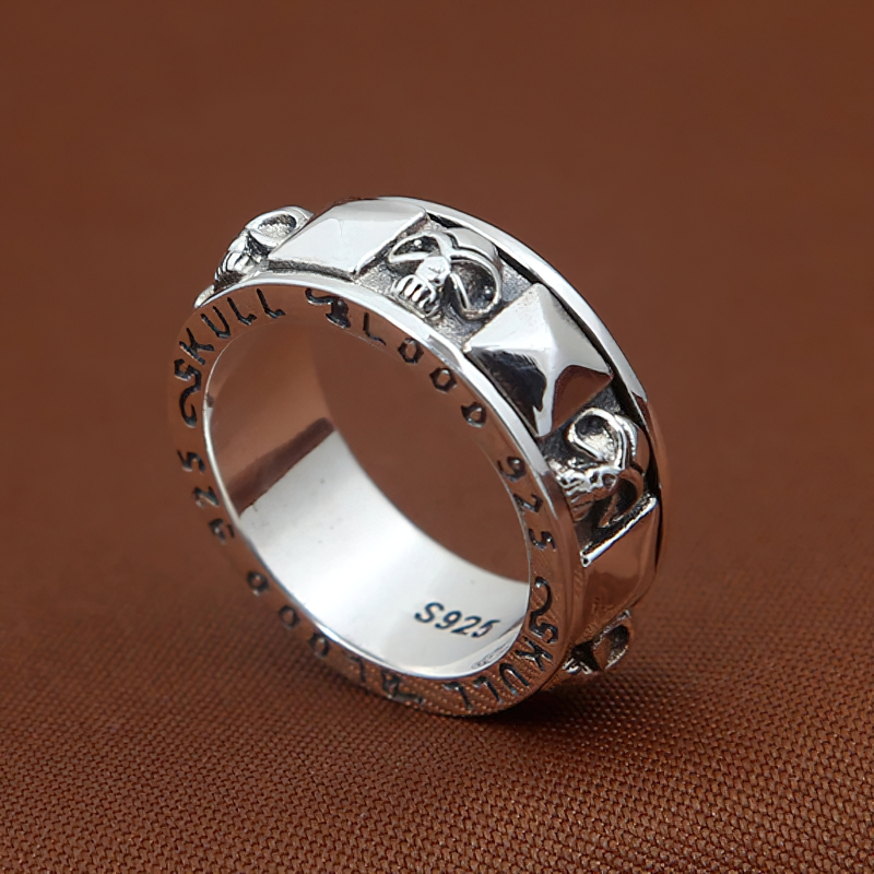 Gothic 925 sterling silver ring featuring skull design and pyramid accents, perfect unisex accessory.