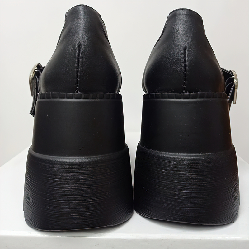 Back view of black leather high pumps with rubber platform and buckle, perfect for gothic outfits and all occasions.
