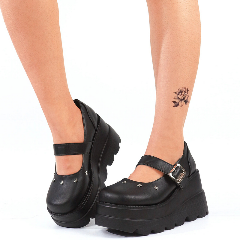 Stylish black platform pumps with buckle detail, perfect for gothic outfits and versatile all-season wear.
